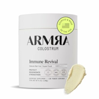 Armra Colostrum Immune Revival supplement container with product sample.