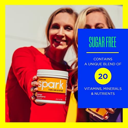 Two people holding a container of Spark energy drink with text highlighting sugar-free and 20 vitamins, minerals, and nutrients.