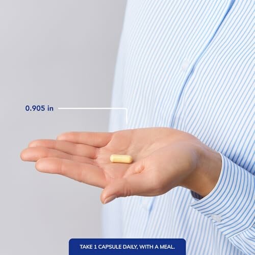 Person holding a capsule in hand with measurement, highlighting the convenience and ease of use of Pure Encapsulations O.N.E. Multivitamin, which is available in capsule form.