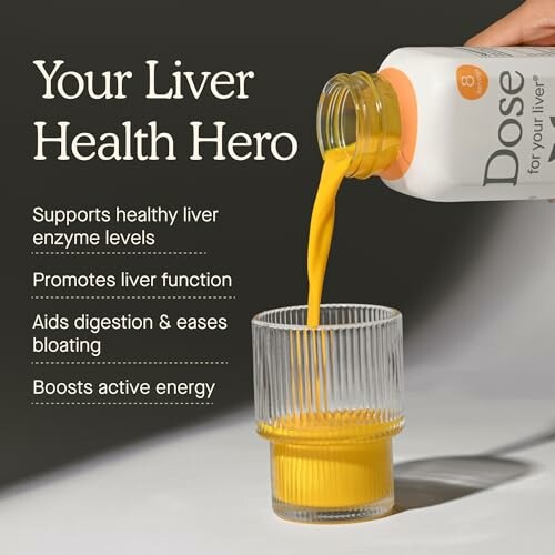Pouring a yellow health drink into a glass for liver health benefits.
