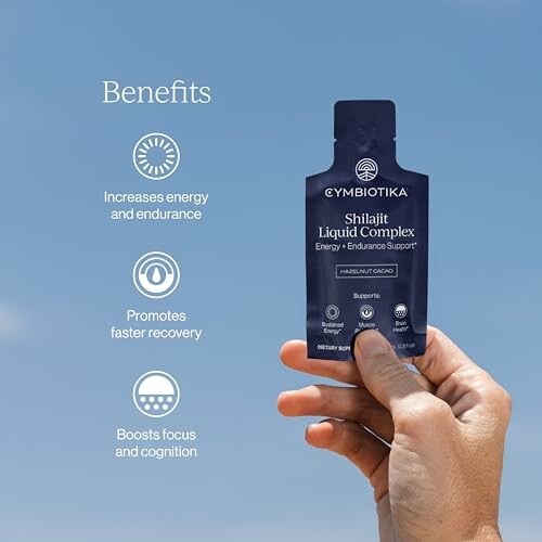 Hand holding Cymbiotika Shilajit Liquid Complex pouch with benefits listed.