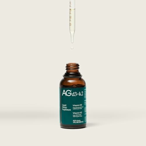 Liquid dropper above vitamin D3 and K2 supplement bottle