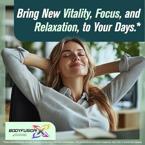 Woman relaxing at desk with hands behind head, smiling.