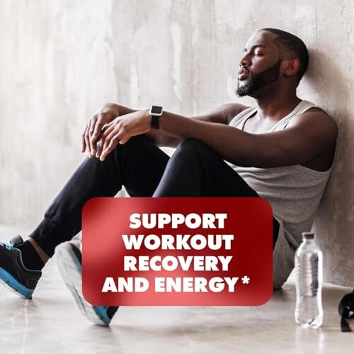 Man resting against a wall after exercise with a water bottle, promoting workout recovery and energy.